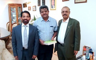 Dr. Majeed  presents the book on BioPerine® to Dr. Amit Agarwal